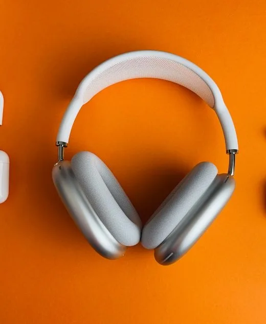 white and gray wireless headphones